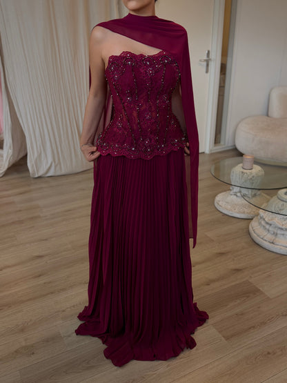 Pleated Gown with Embellished Corset and Cape