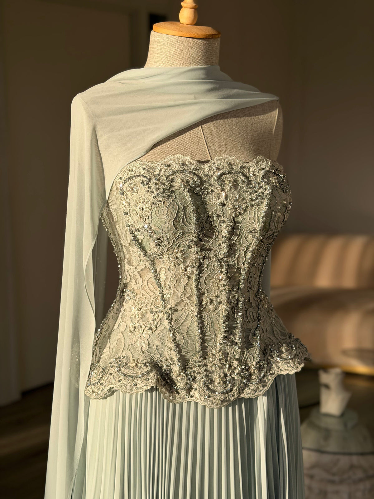 Pleated Gown with Embellished Corset and Cape