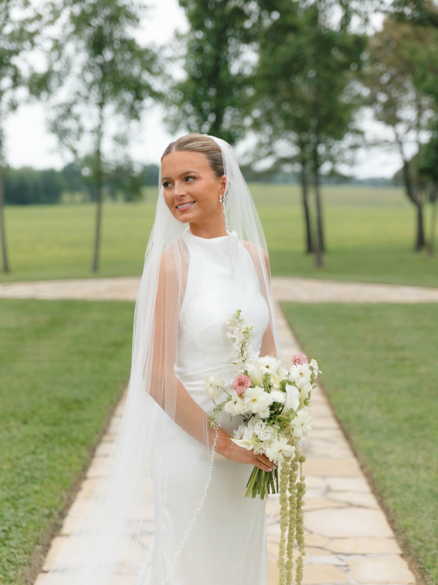 Sleeveless High-Neck Sheath Wedding Gown with Sweep Train