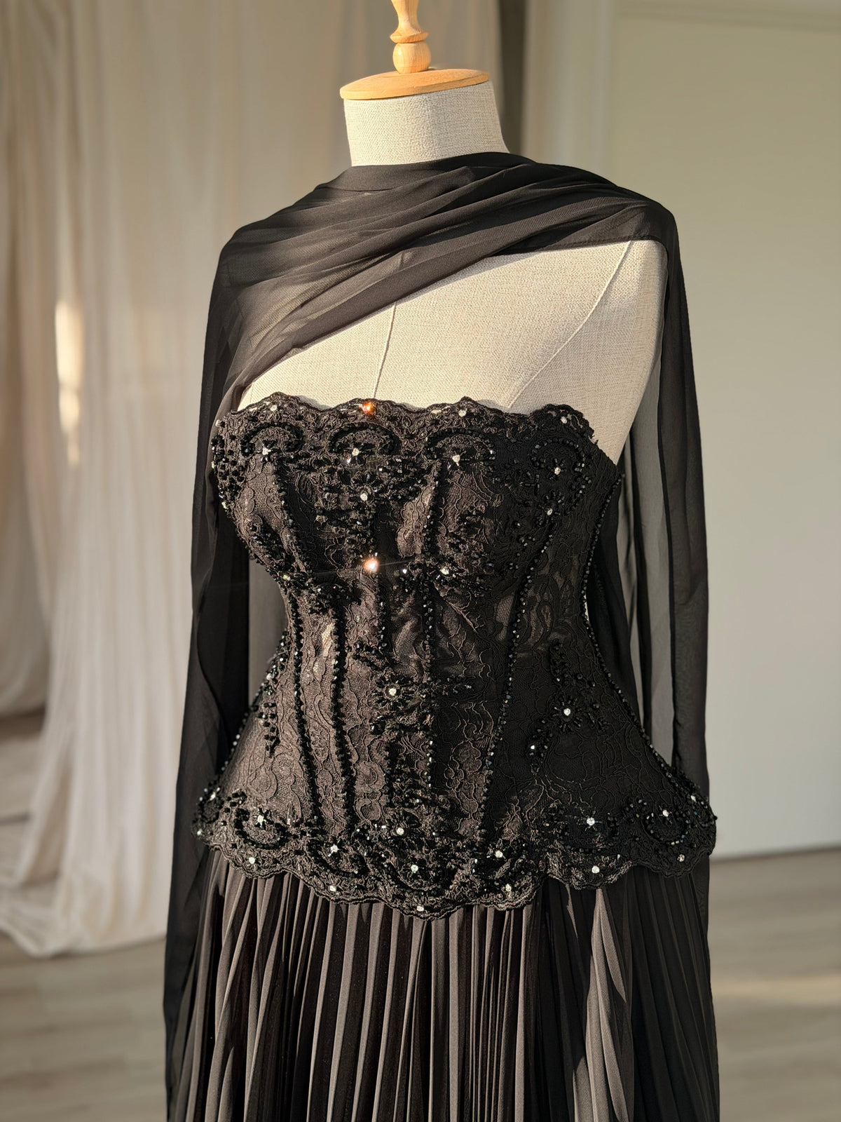 Pleated Gown with Embellished Corset and Cape