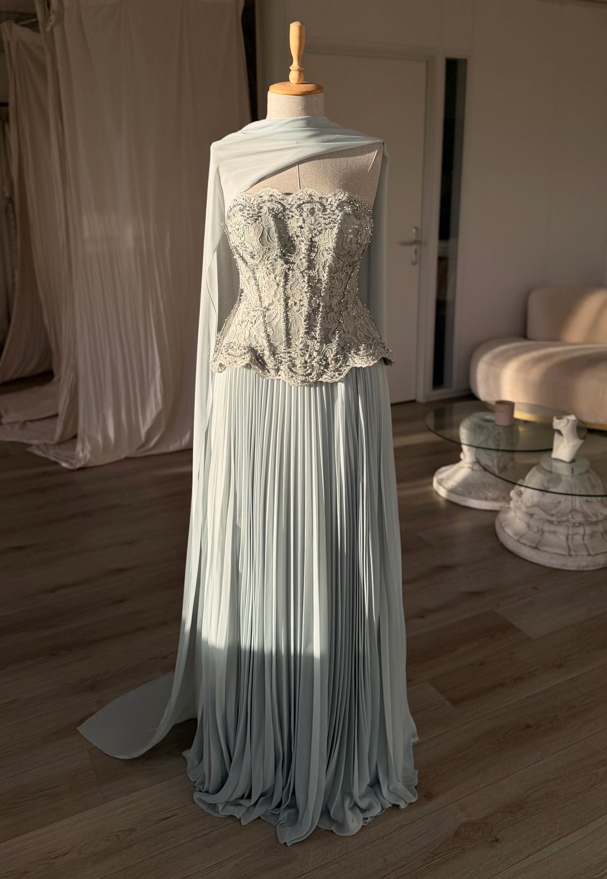 Pleated Gown with Embellished Corset and Cape