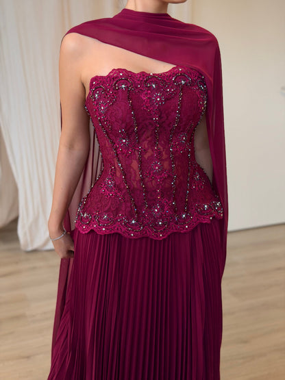Pleated Gown with Embellished Corset and Cape