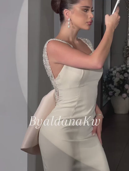 Elegant Beaded Scoop Neck Dress with Statement Back Bow
